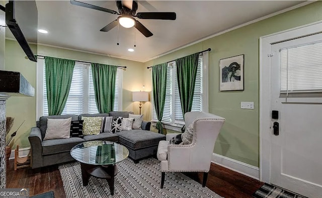 living room featuring hardwood / wood-style floors, a healthy amount of sunlight, and ornamental molding