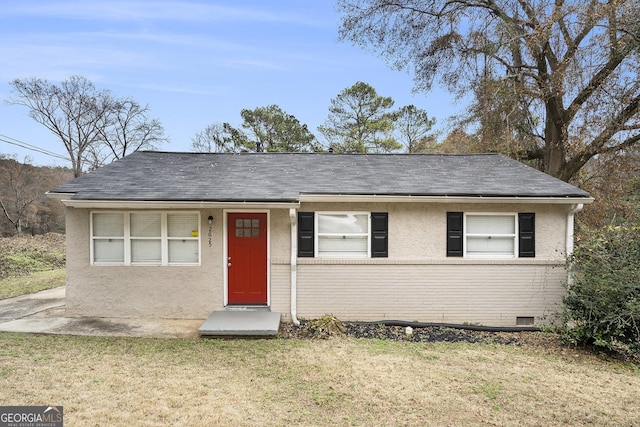 ranch-style home with a front yard