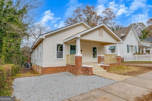 bungalow featuring central AC unit