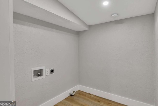 washroom featuring washer hookup, hardwood / wood-style flooring, and electric dryer hookup