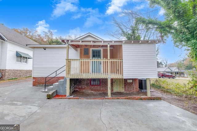 back of property featuring central AC unit