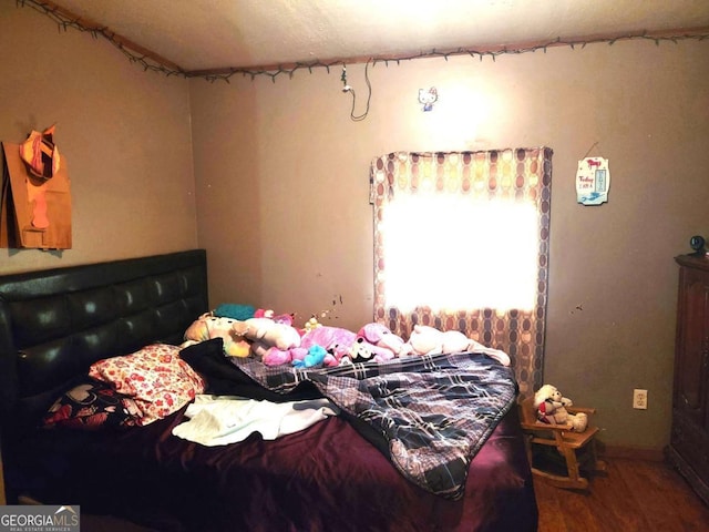 bedroom featuring hardwood / wood-style flooring