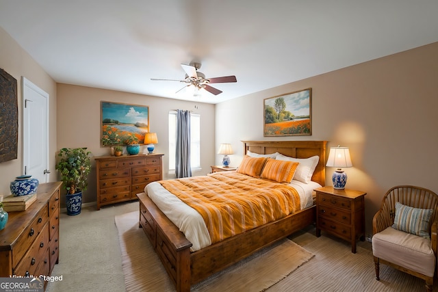 bedroom featuring ceiling fan and light colored carpet