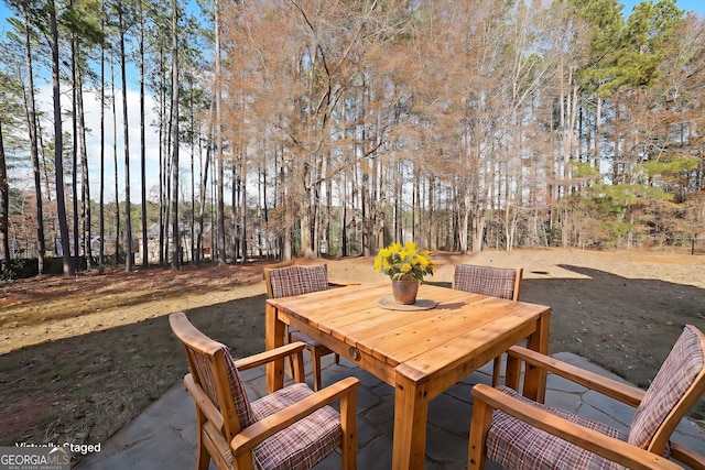 view of patio featuring outdoor dining area