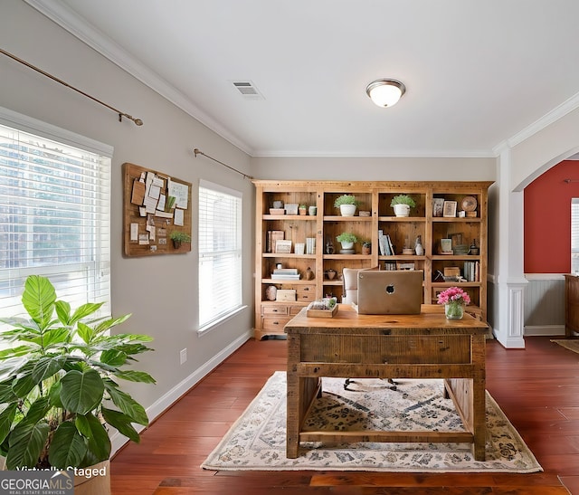 office with dark wood-type flooring, arched walkways, visible vents, and crown molding