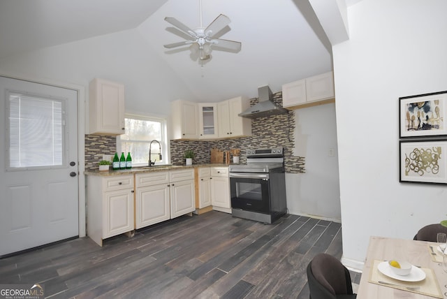 kitchen with dark hardwood / wood-style flooring, sink, wall chimney range hood, electric range, and high vaulted ceiling