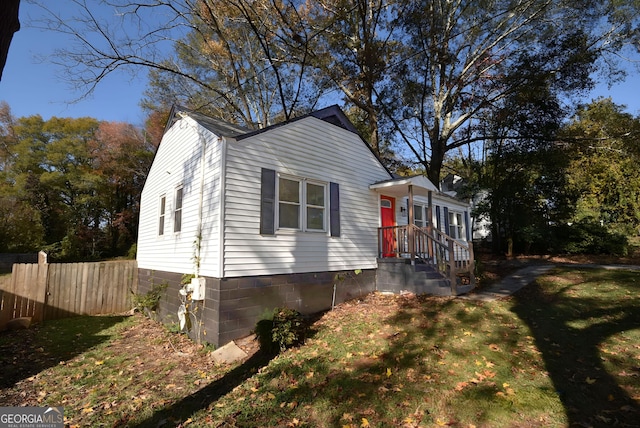 view of property exterior featuring a yard