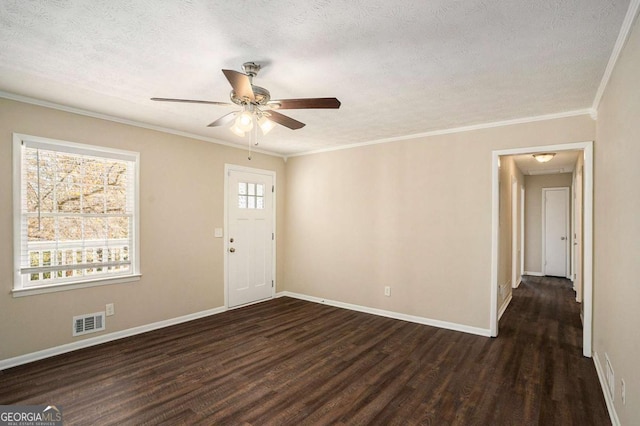 unfurnished room with dark hardwood / wood-style flooring, a textured ceiling, and ornamental molding