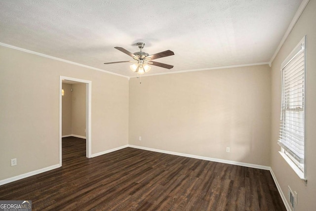 empty room featuring a textured ceiling, crown molding, and dark wood-type flooring