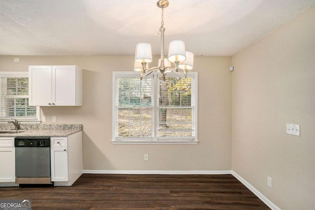 kitchen with dishwasher, pendant lighting, dark hardwood / wood-style flooring, and white cabinetry