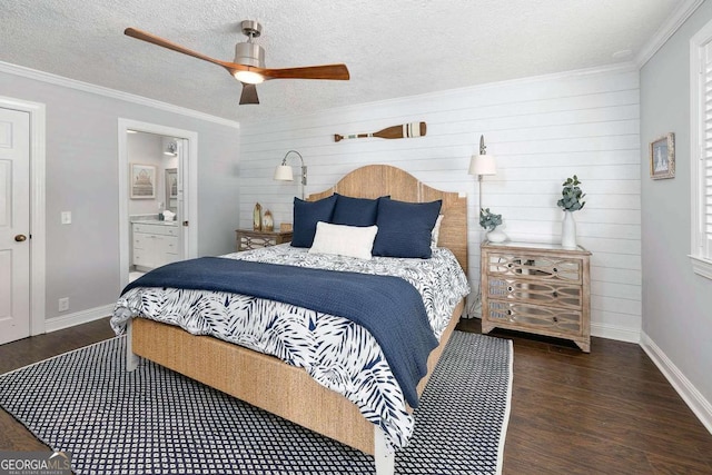 bedroom with ensuite bath, ceiling fan, dark wood-type flooring, and crown molding