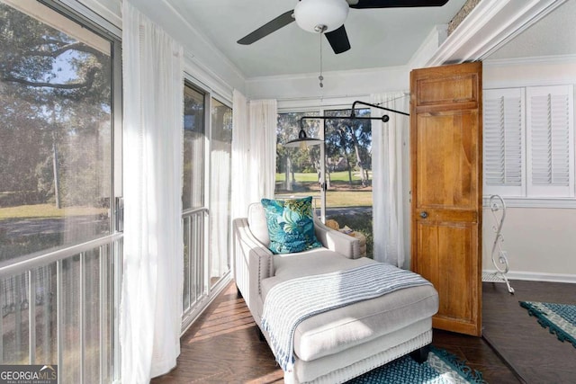 sunroom with ceiling fan