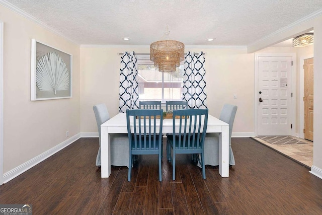 dining area with dark hardwood / wood-style flooring and a textured ceiling