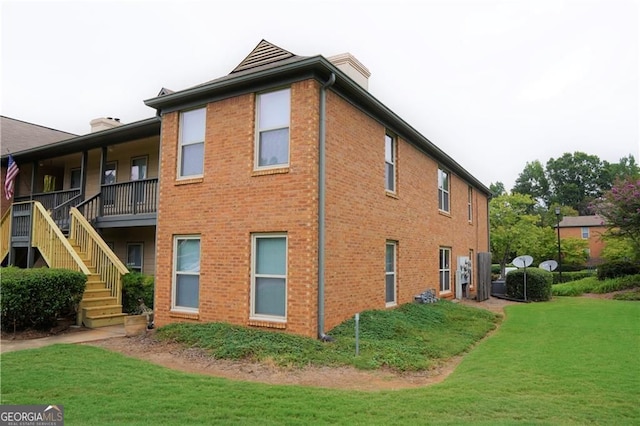 view of home's exterior with a yard