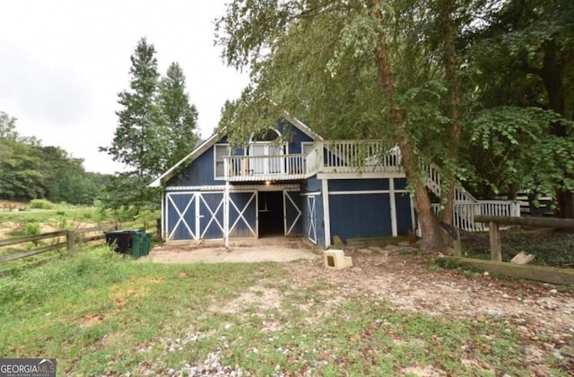 exterior space featuring a deck and fence