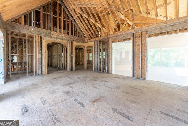 miscellaneous room featuring high vaulted ceiling