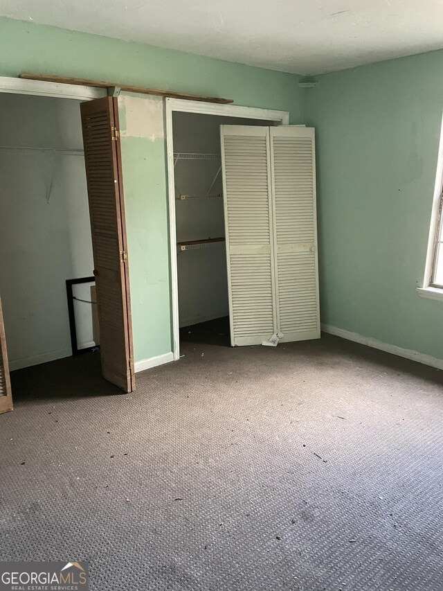 unfurnished bedroom with carpet floors