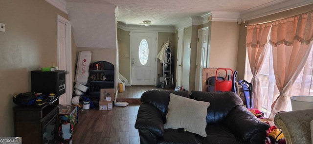 living room with hardwood / wood-style flooring, a healthy amount of sunlight, crown molding, and a textured ceiling