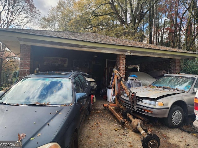 garage featuring a carport