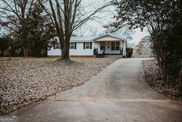 ranch-style home with covered porch