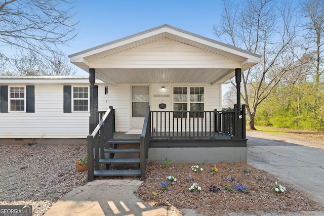 view of front of property with a porch and crawl space