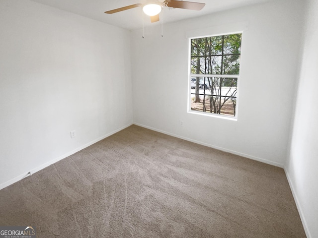 carpeted empty room with ceiling fan