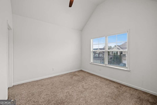 unfurnished room featuring ceiling fan, carpet floors, and vaulted ceiling