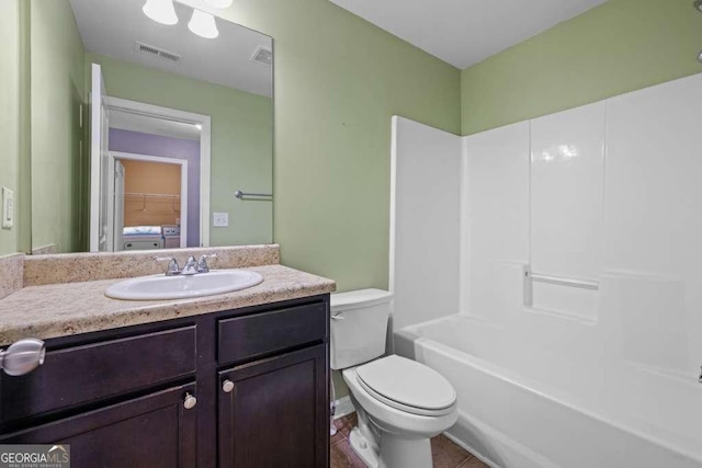 full bathroom with tile patterned flooring, vanity, toilet, and washtub / shower combination