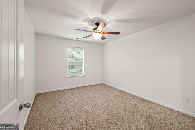 carpeted empty room with ceiling fan