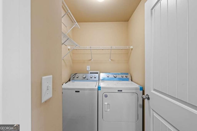 laundry room with washing machine and dryer