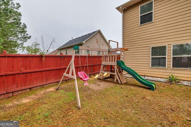 view of playground featuring a lawn