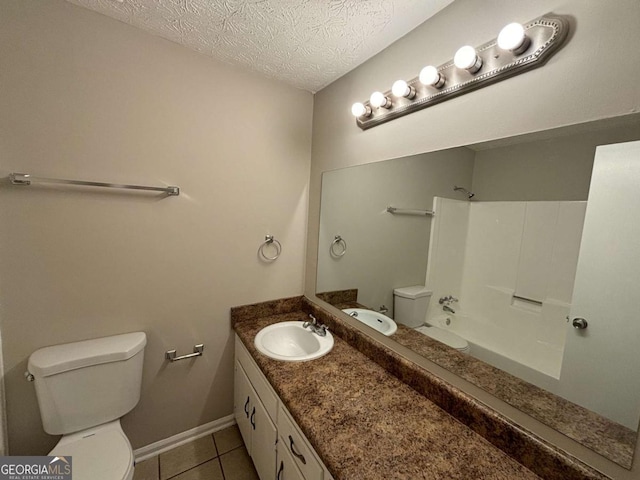 full bathroom featuring a textured ceiling, bathtub / shower combination, toilet, tile patterned floors, and vanity