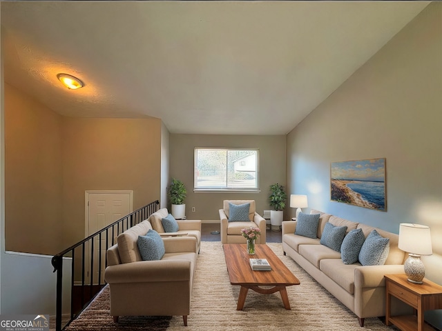 living room featuring vaulted ceiling