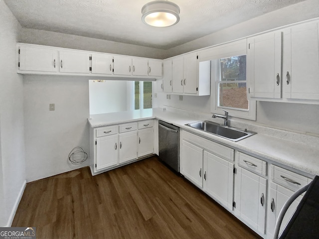 kitchen with dishwasher, sink, dark wood-type flooring, a textured ceiling, and white cabinets