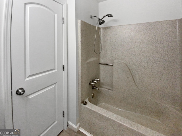 bathroom featuring washtub / shower combination