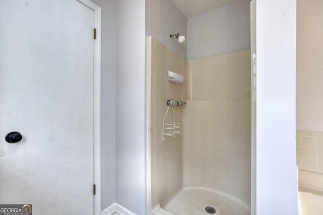 bathroom featuring walk in shower