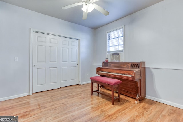 misc room featuring ceiling fan and light hardwood / wood-style flooring