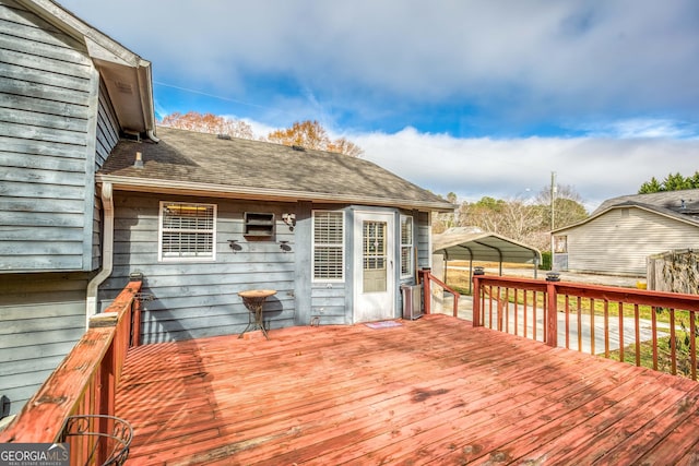 wooden deck featuring a carport