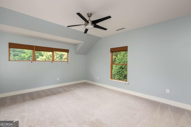 bonus room featuring a wealth of natural light, carpet floors, and vaulted ceiling