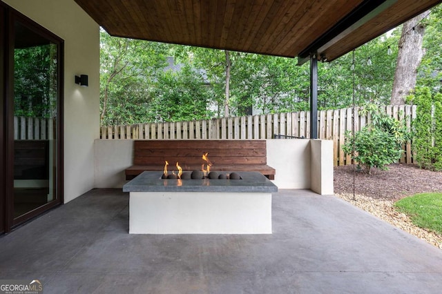 view of patio / terrace featuring a fire pit