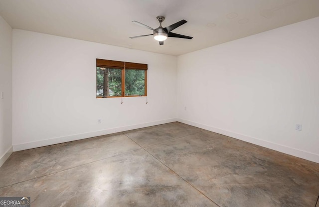 unfurnished room with concrete flooring and ceiling fan