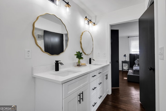 bathroom featuring vanity and wood-type flooring