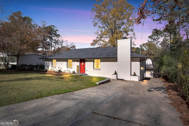 view of front of house with a lawn