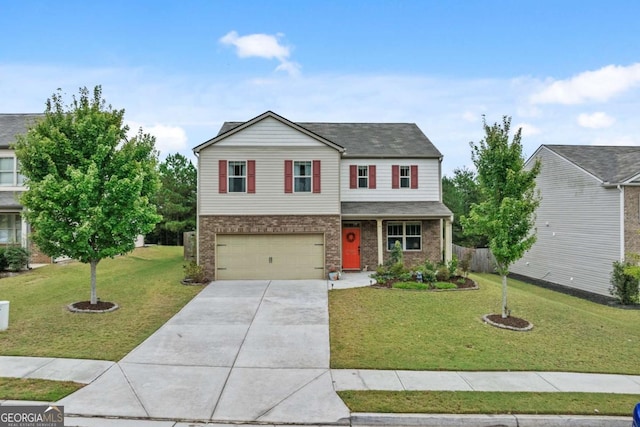 view of front of house featuring a front yard and a garage