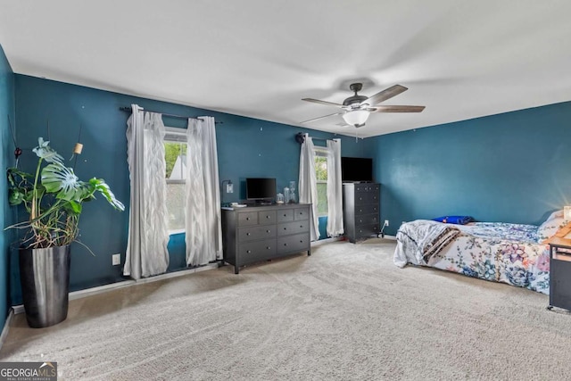 carpeted bedroom featuring ceiling fan