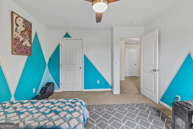 unfurnished bedroom featuring carpet floors and ceiling fan