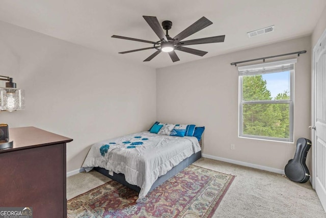 carpeted bedroom with ceiling fan