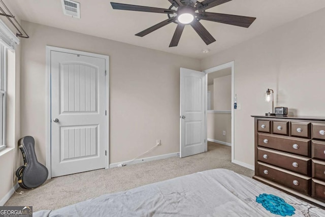 carpeted bedroom featuring ceiling fan