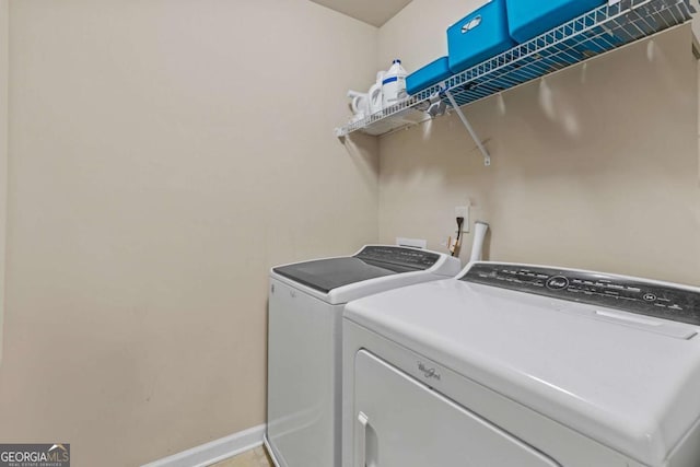 laundry room featuring separate washer and dryer