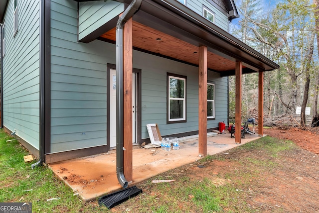 view of side of property with a patio area